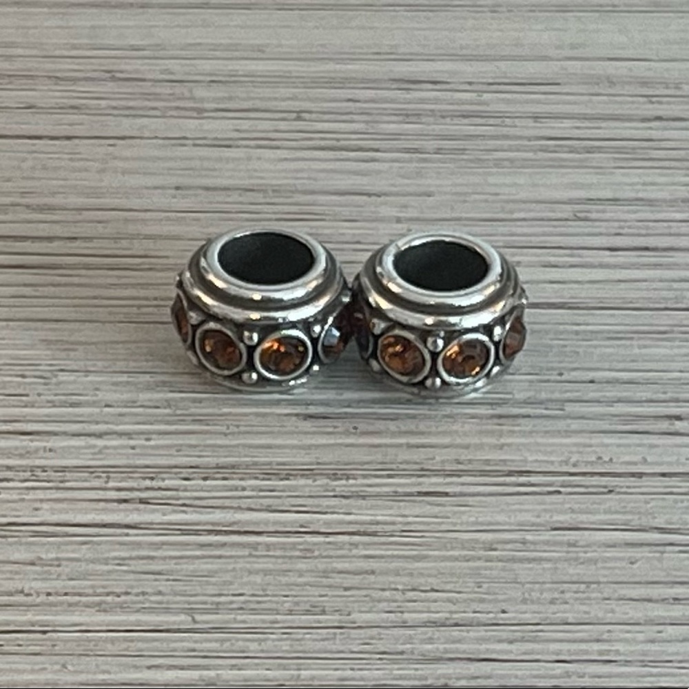A Pair of Retired Brighton Brown and Silver Beads Bead